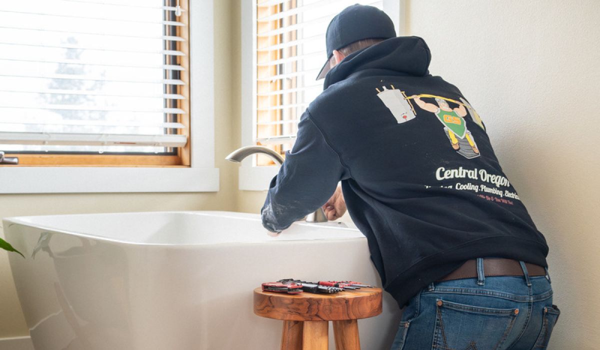 Image of a wrench tightening a leaking faucet