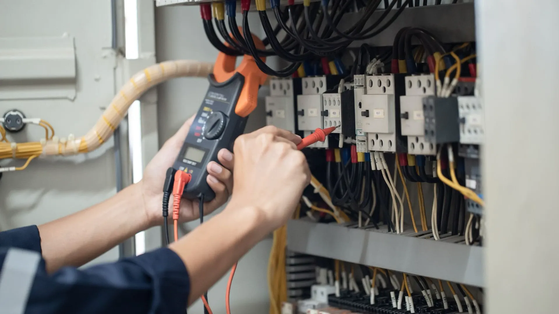 Electrician rewiring a whole house in Bend, Oregon.