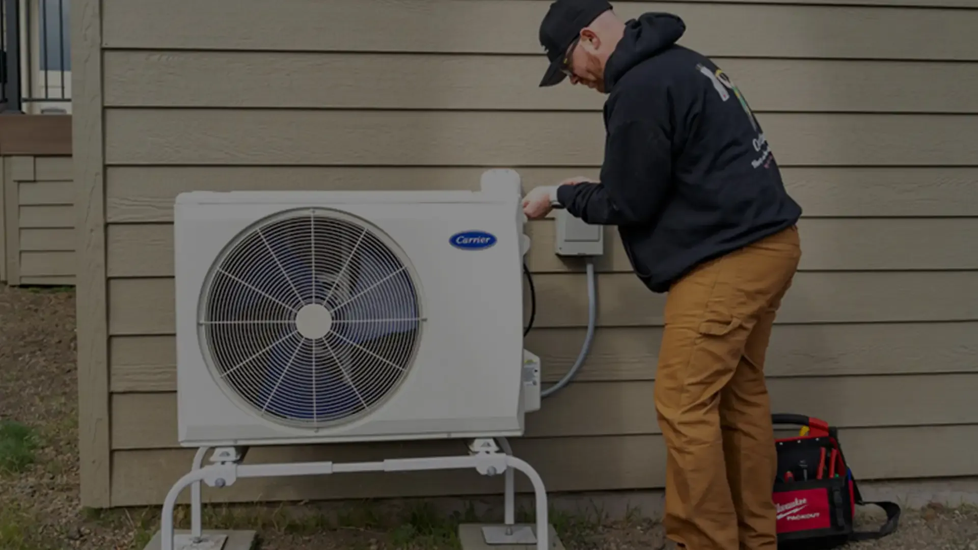 Technician servicing a heat pump in Central Oregon home.