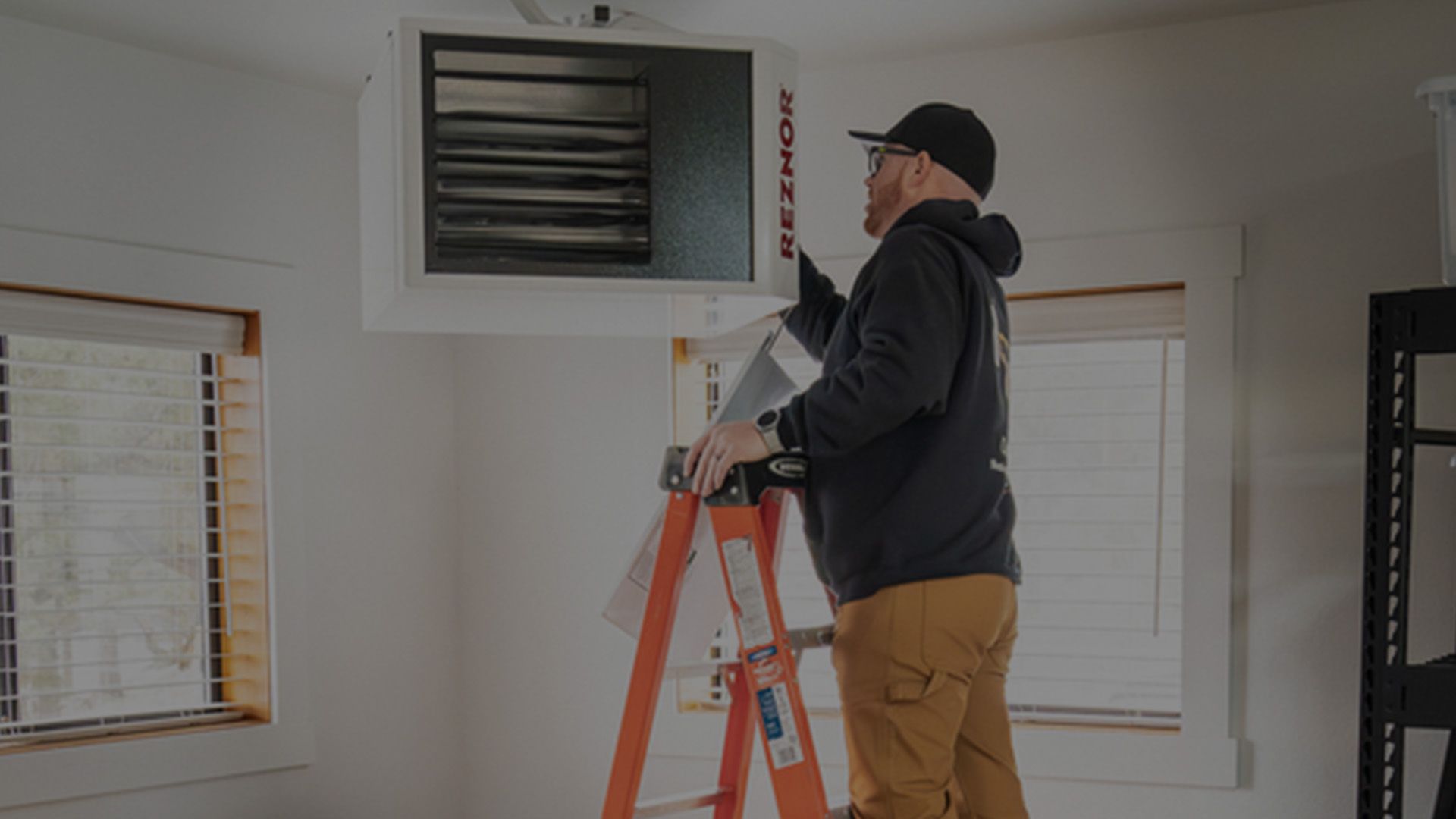 HVAC technician servicing a heating system in Central Oregon.