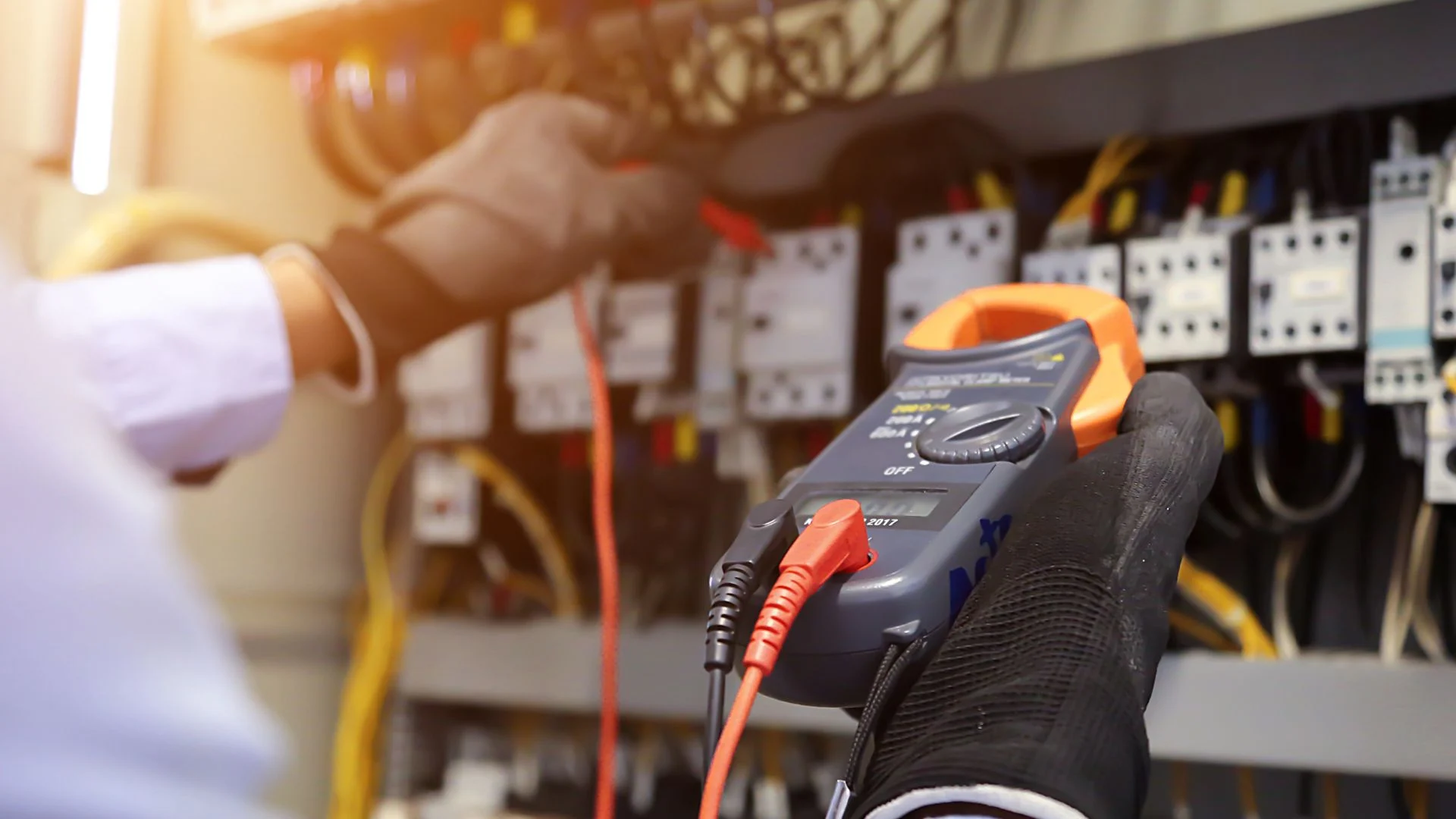 Electrician in Central Oregon fixing an electrical failure in winter.