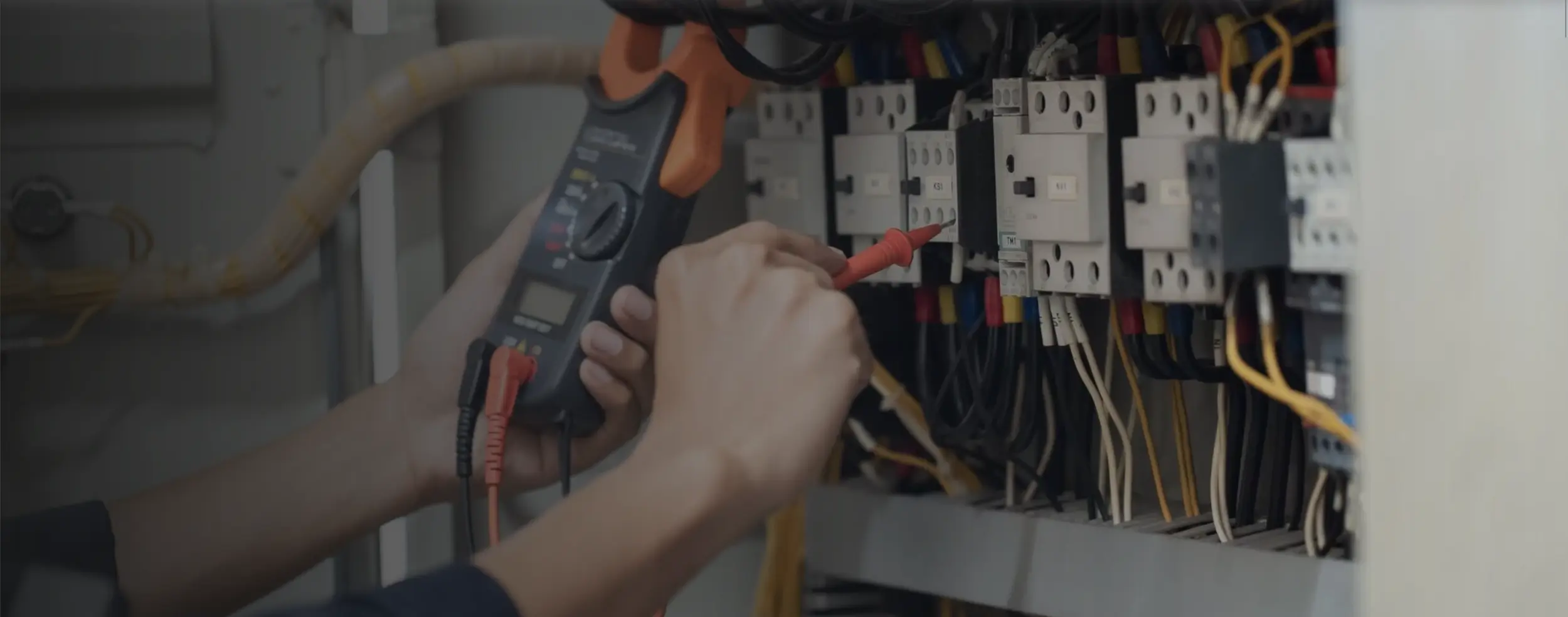 Electrician testing a newly upgraded electrical panel in Bend home.