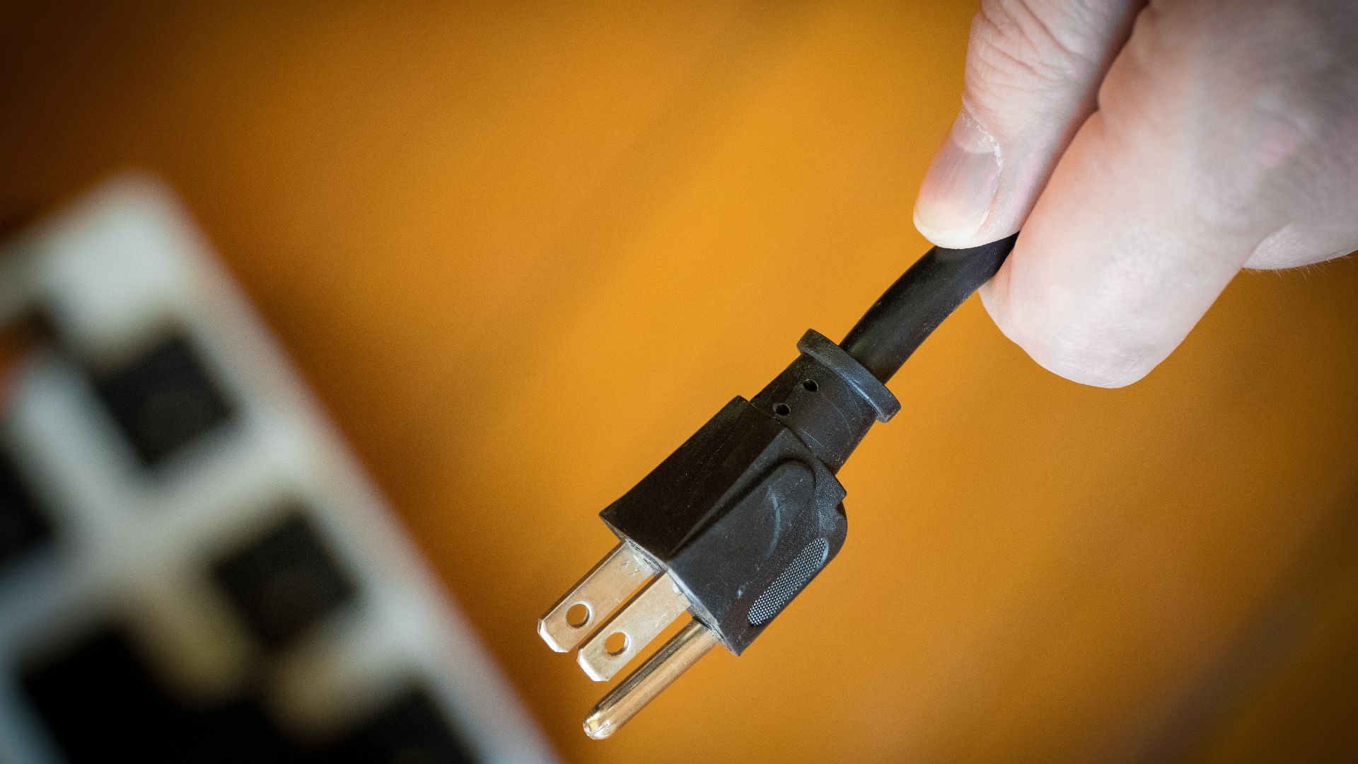 Electrician testing a newly installed surge protector in a Central Oregon home.