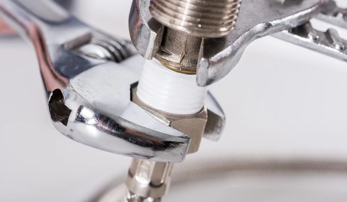 Plumber doing a maintenance in Central Oregon home.