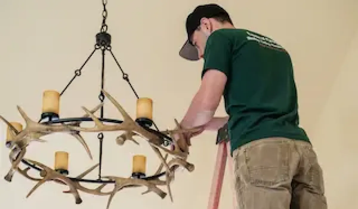 Image of an electrician in Denver rewiring a customers home