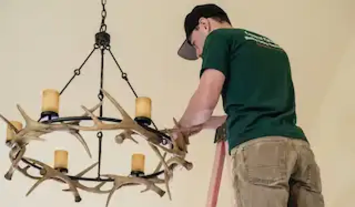 Image of an electrician in Denver rewiring a customers home
