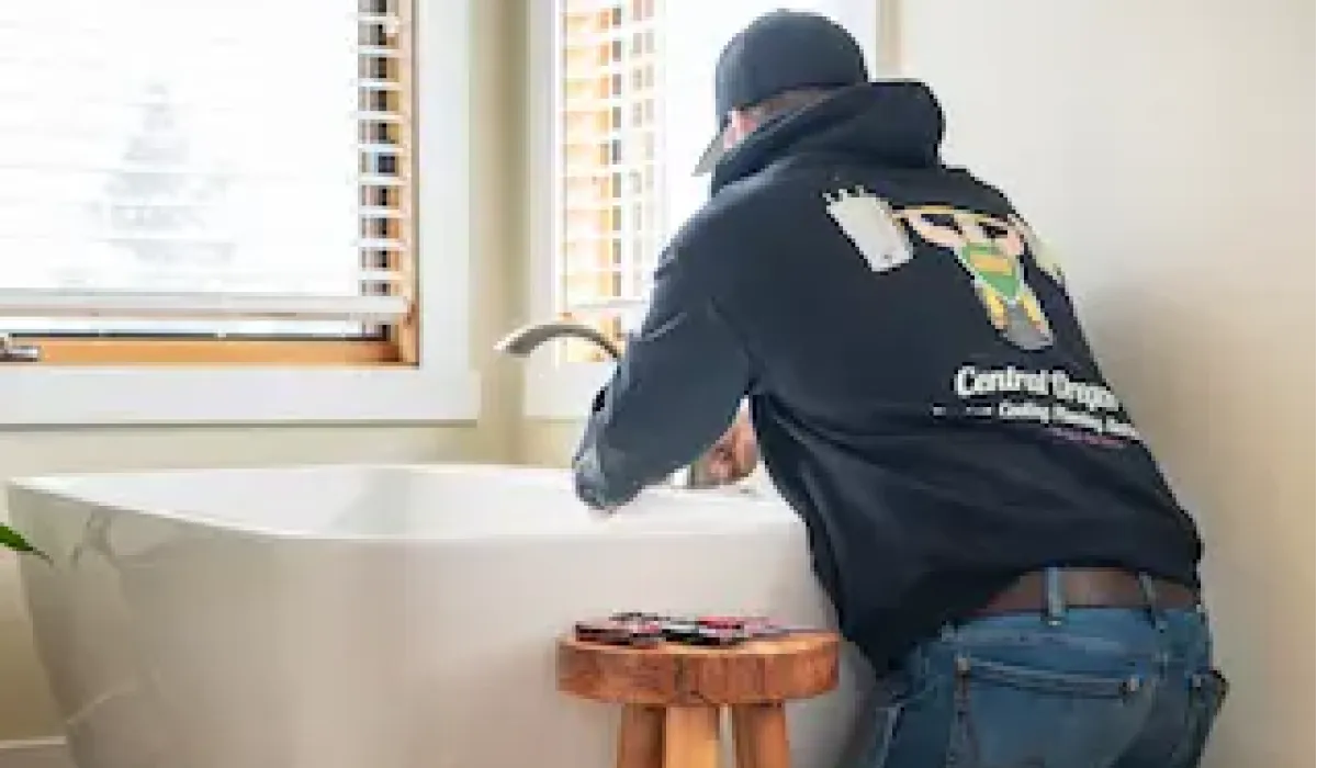 Image of a wrench tightening a leaking faucet