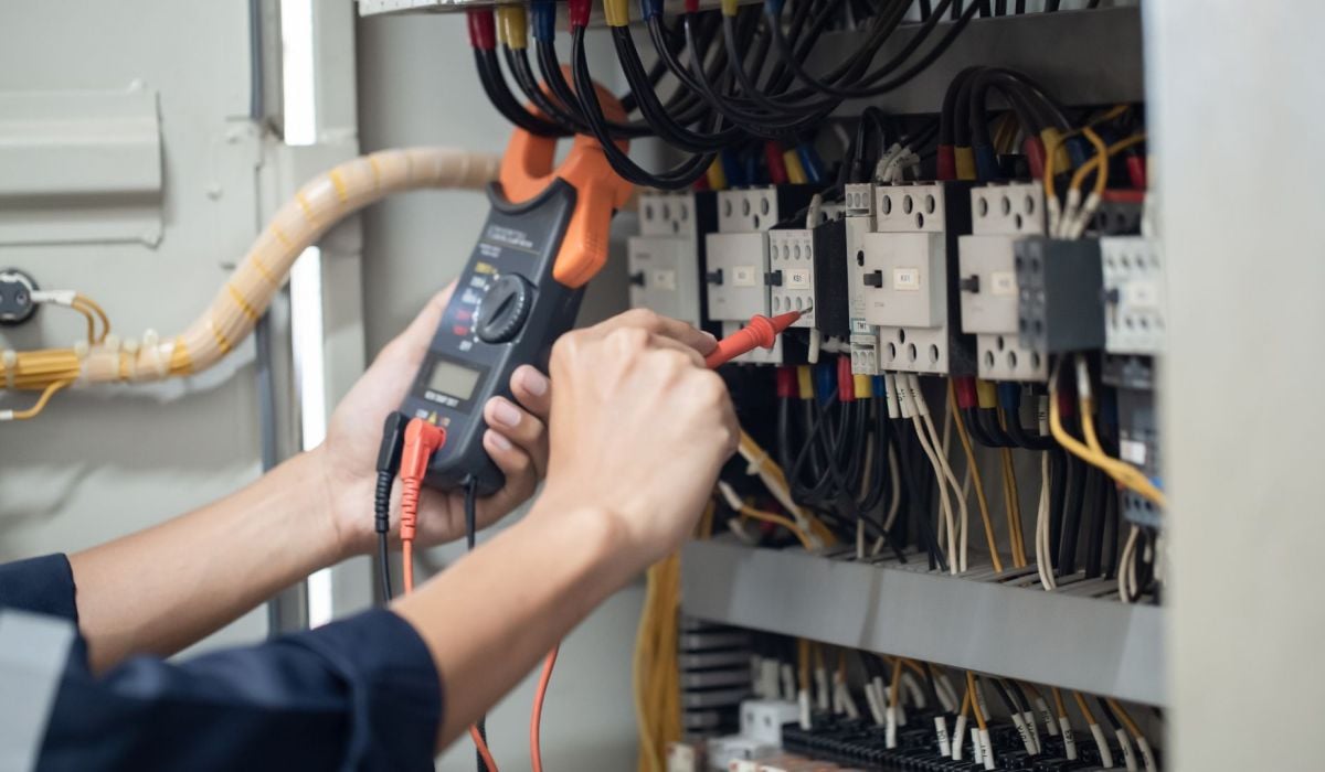 Image of an electrician in Denver rewiring a customers home